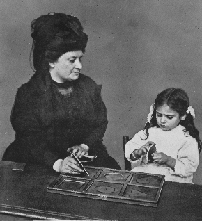 Woman teaching child with educational tools.